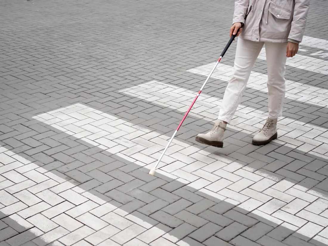 blind-person-walking-through-city-with-blind-stick