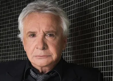 On sait pourquoi Michel Sardou n'était pas aux obsèques de Charles...