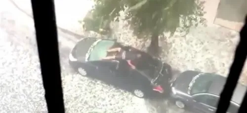 Cet homme tente de sauver sa voiture de la grêle ! (vidéo)